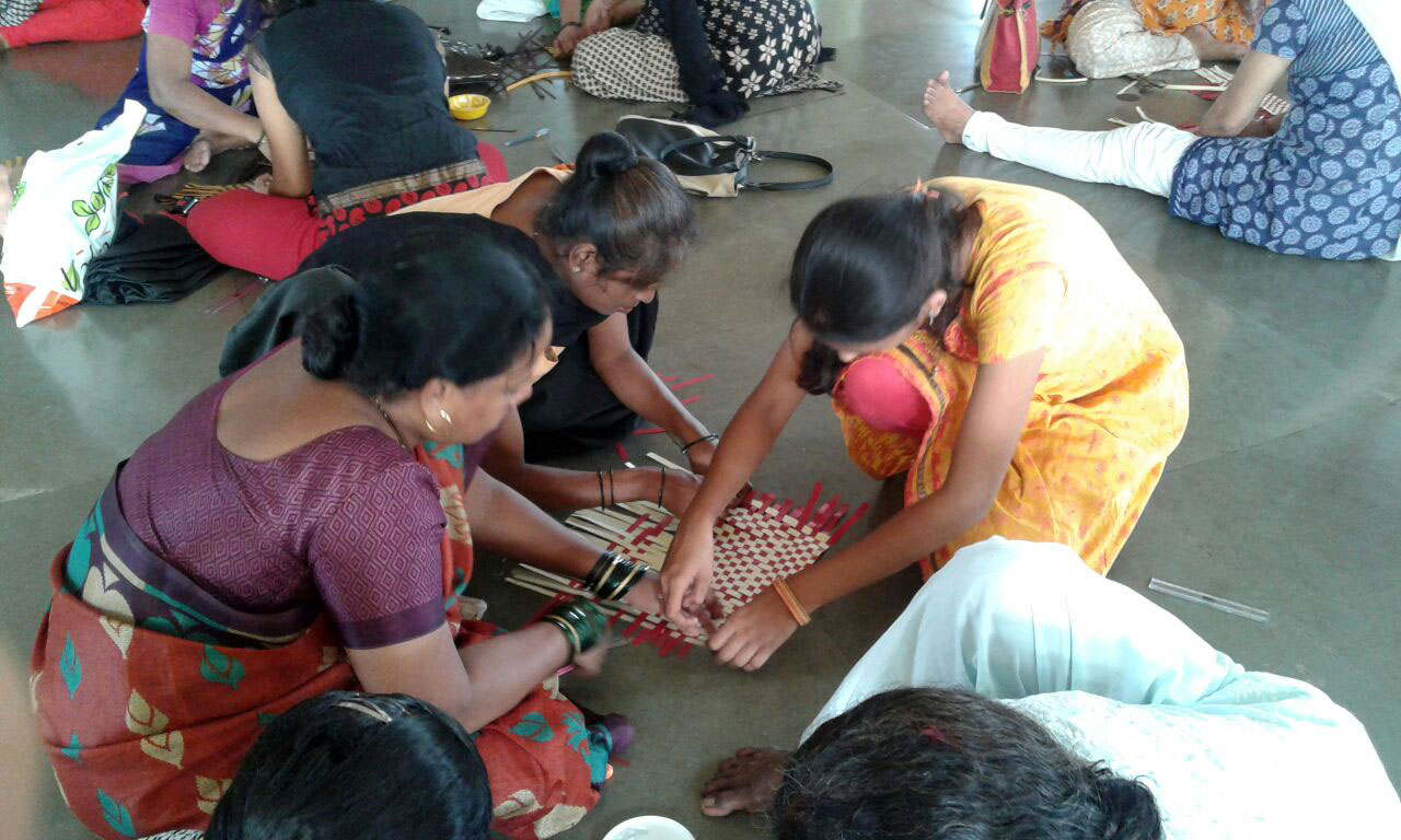 All the women engrossed in the mat weaving workshop