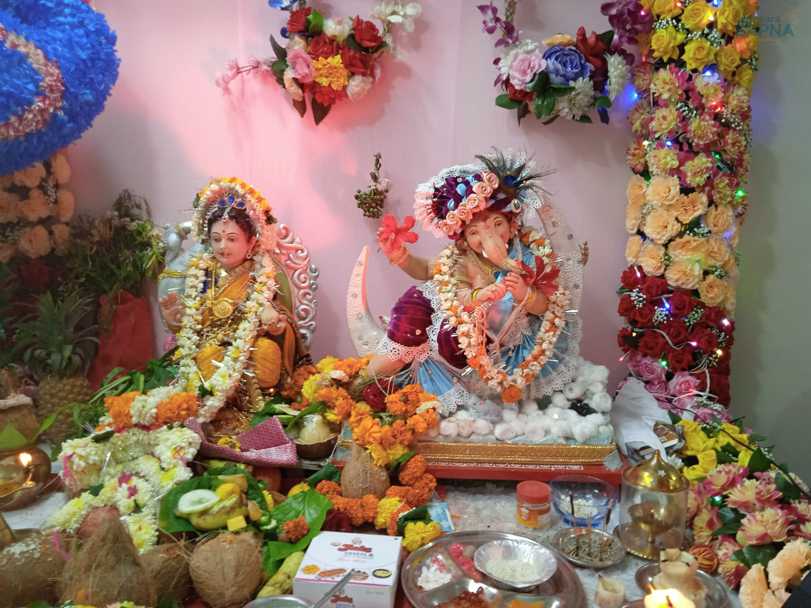 Colourful flower decorations and beautiful lights was a lovely pandal for Guari and Ganapati celebration in a beneficiary’s home.