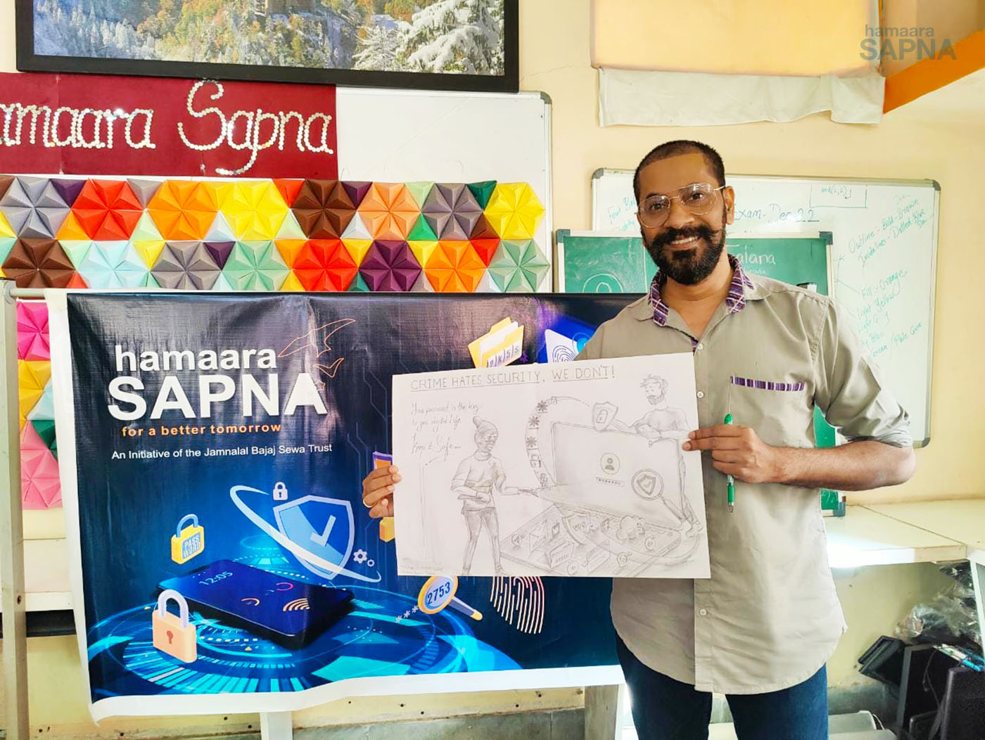 The computer teacher from Tardeo centre shows a very novel and effective drawing of how cyber crime takes place through any electronic application.