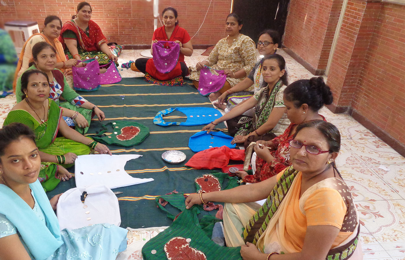 Recycling of waste into useful things which is like Magic. Cloth bags made from waste by Ladies 