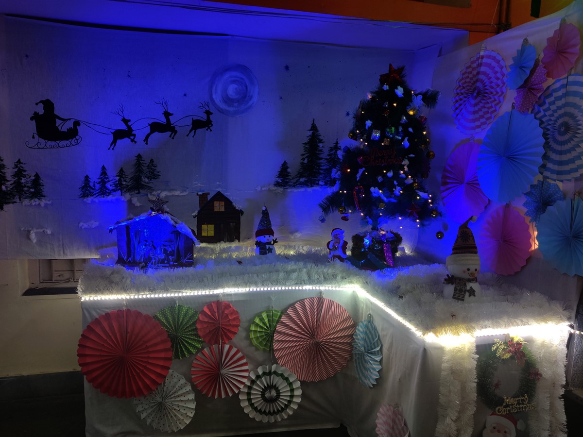 Beautiful crib, hand painted backdrop and the Christmas tree were the highlights of the Christmas party