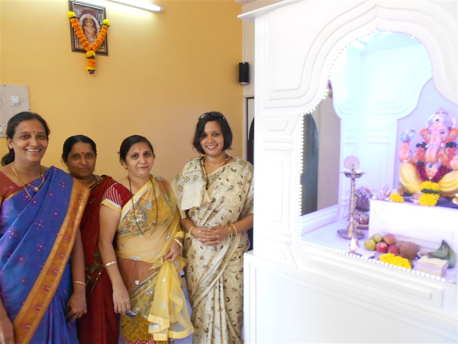 Hamaara Sapna staff visiting a beneficiary's house for Ganpati