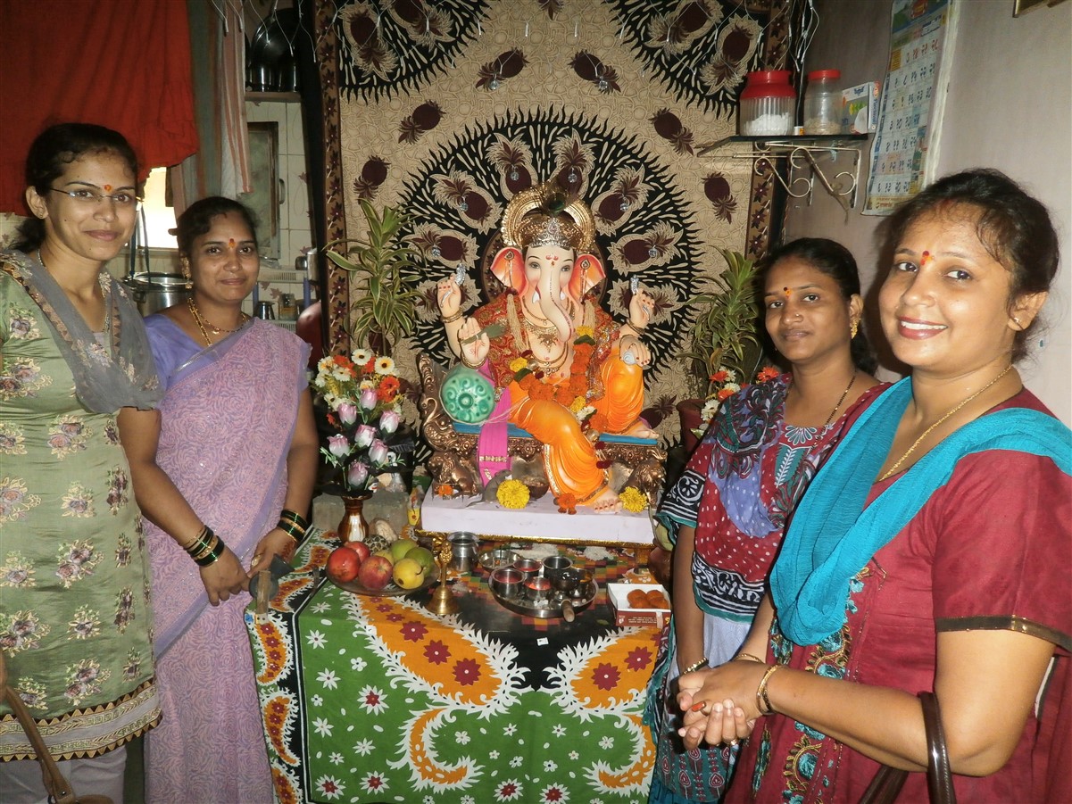 Hamaara Sapna Project Co-Ordinator and the staff visiting women on the occasion of the Ganesh Festival