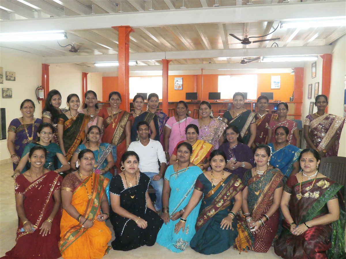 Smiles galore as women pose in their beautiful saris