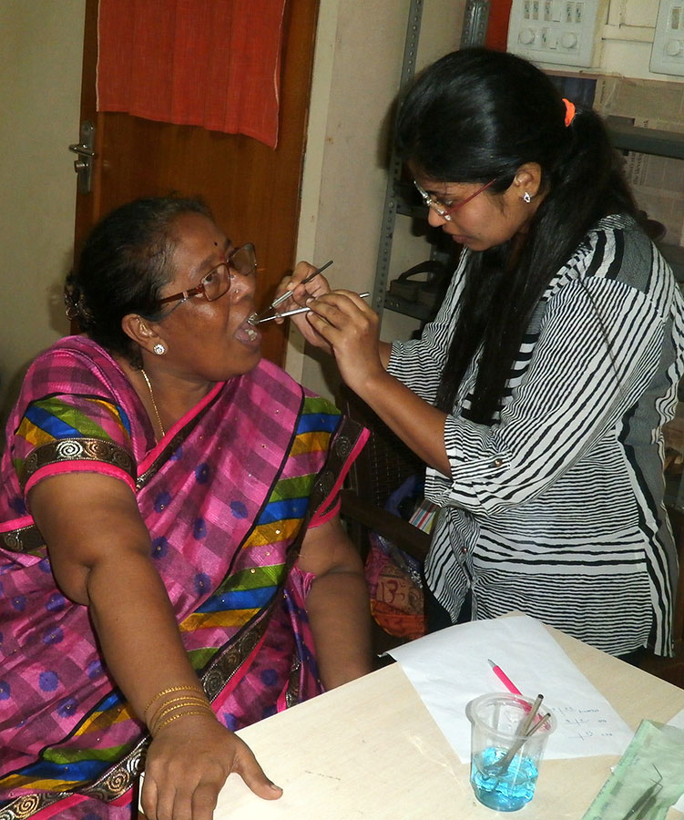 Dr. Rucha Baphna checking the teeth of a beneficiary (October, 2016)