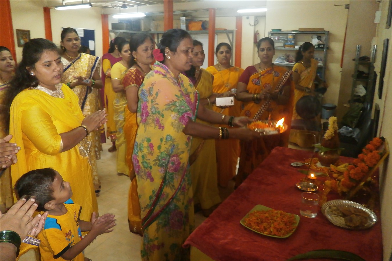 Performing the puja at the beginning of the programme
