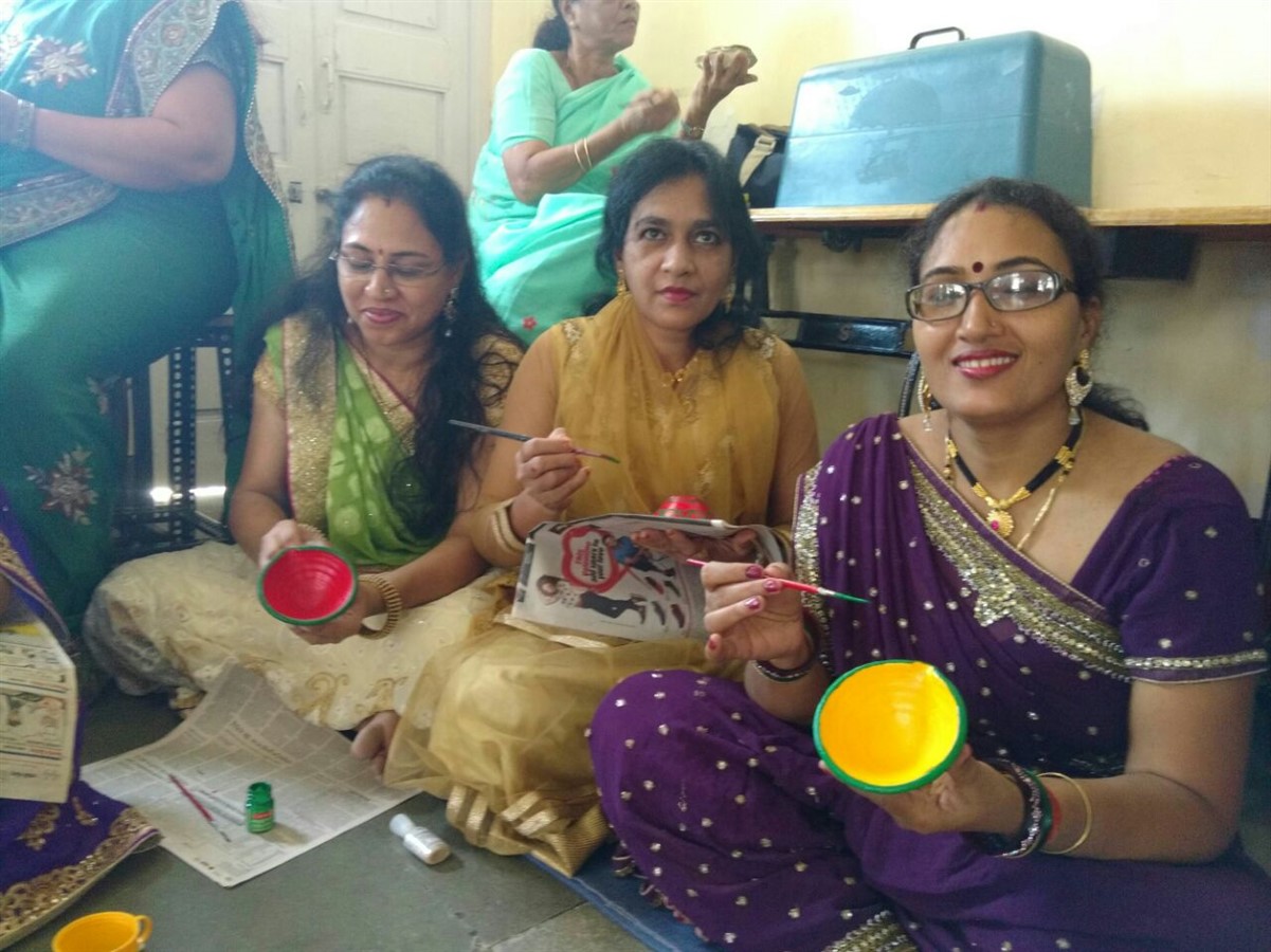 Attractive diyas being made by the beneficiaries