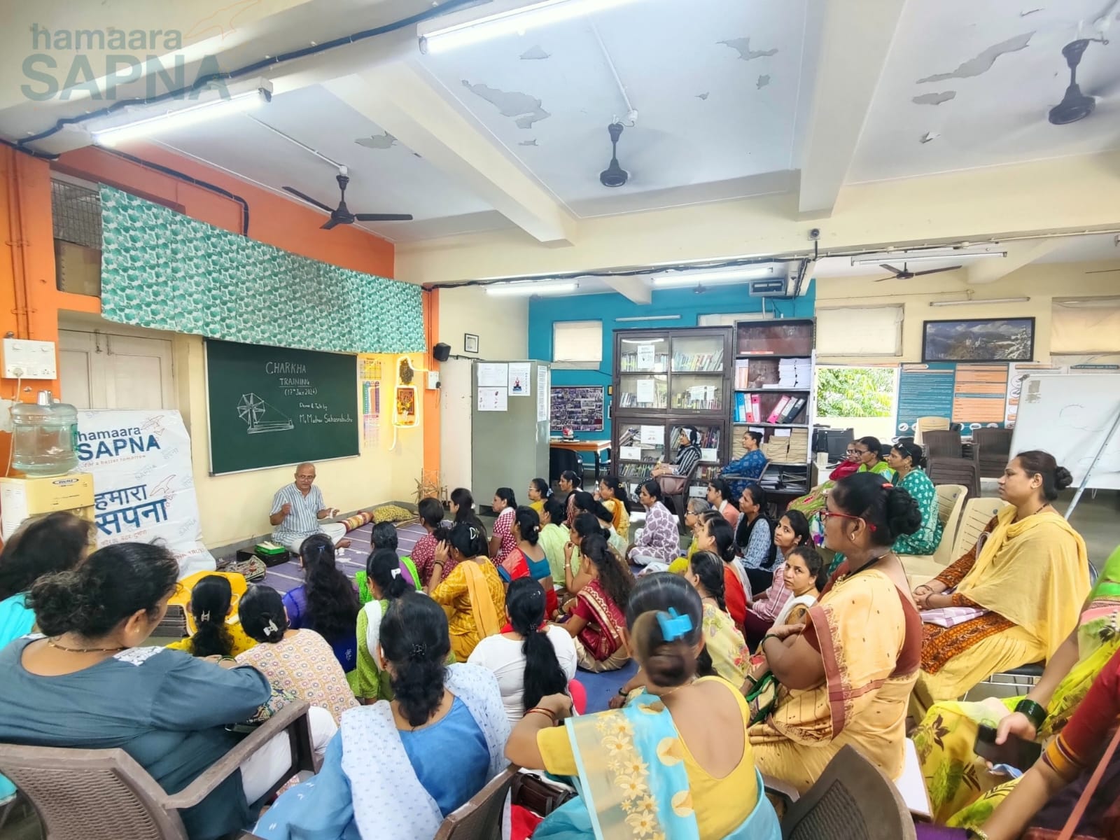 Women attentively listen to the talk on Charkha, its history, importance during the Indian freedom struggle and why now